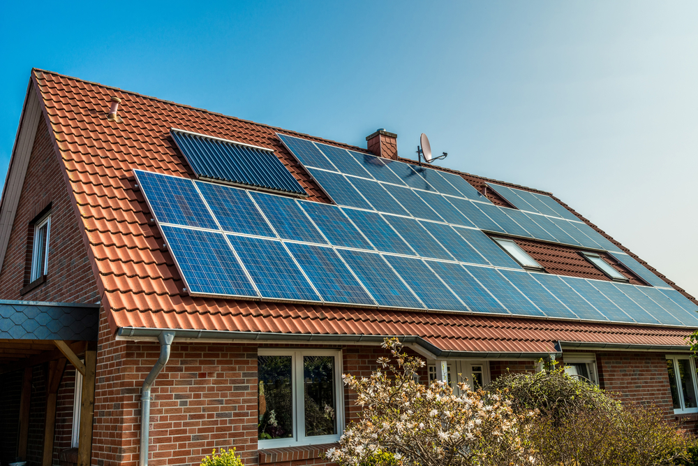 How much power would an average 4 kW solar system installed in the south of england generate in a year?